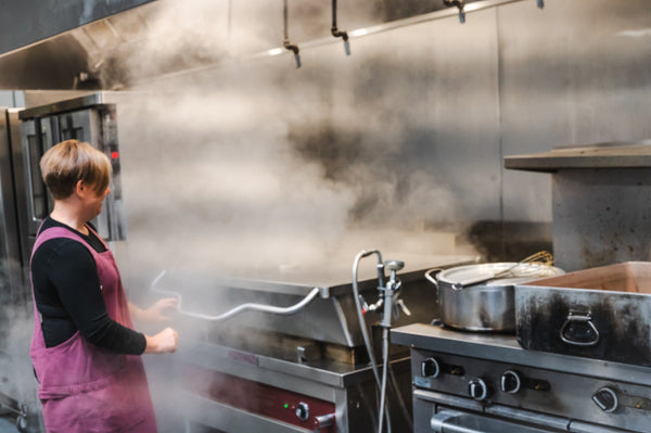 Heidi Finley, founder and head chef of Maven Meals, cooking in the Maven kitchen near Angle Lake in SeaTac