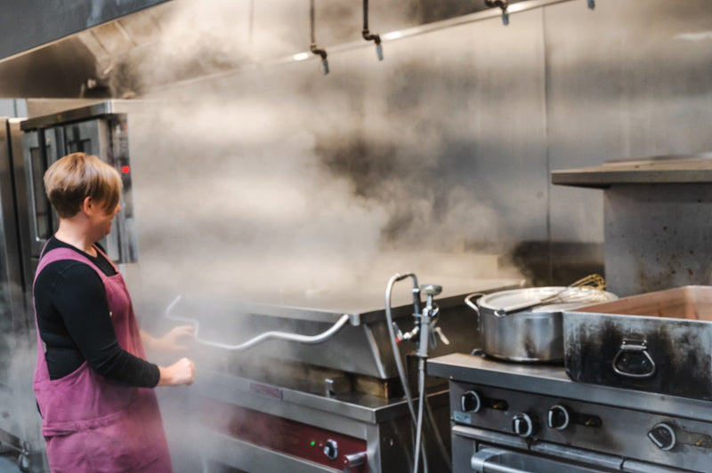 Heidi Finley, founder and head chef of Maven Meals, cooking in the Maven kitchen near Angle Lake in SeaTac