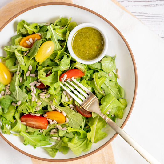 Arugula Salad with Toasted Sunflower Seeds and Pesto Vinaigrette