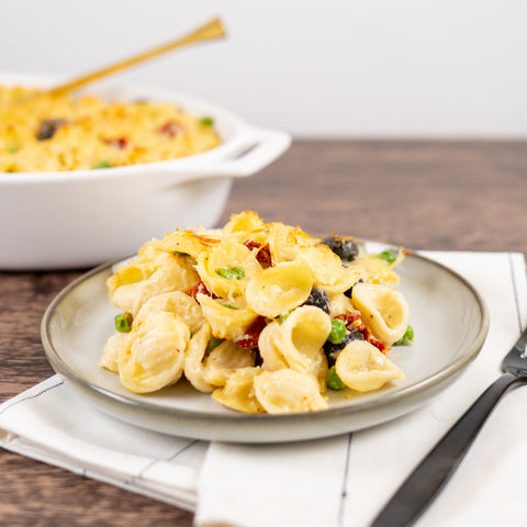 Creamy Baked Orecchiette with Fresh Peas, Kalamata and Sundried Tomatoes
